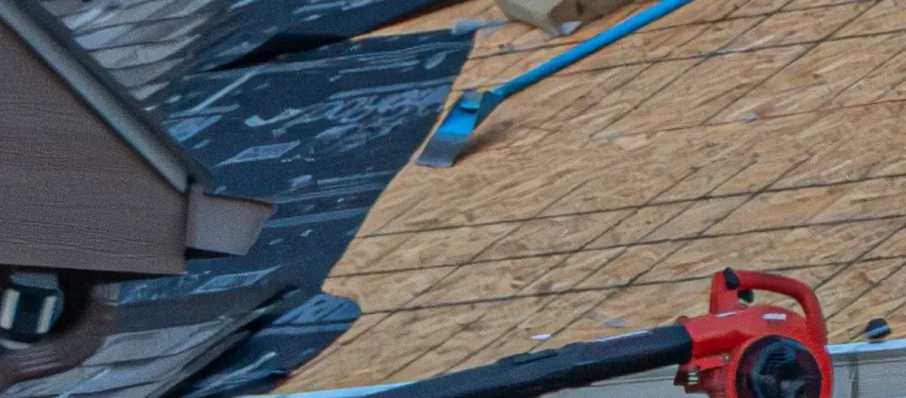 Underlayment being installed over a roof deck