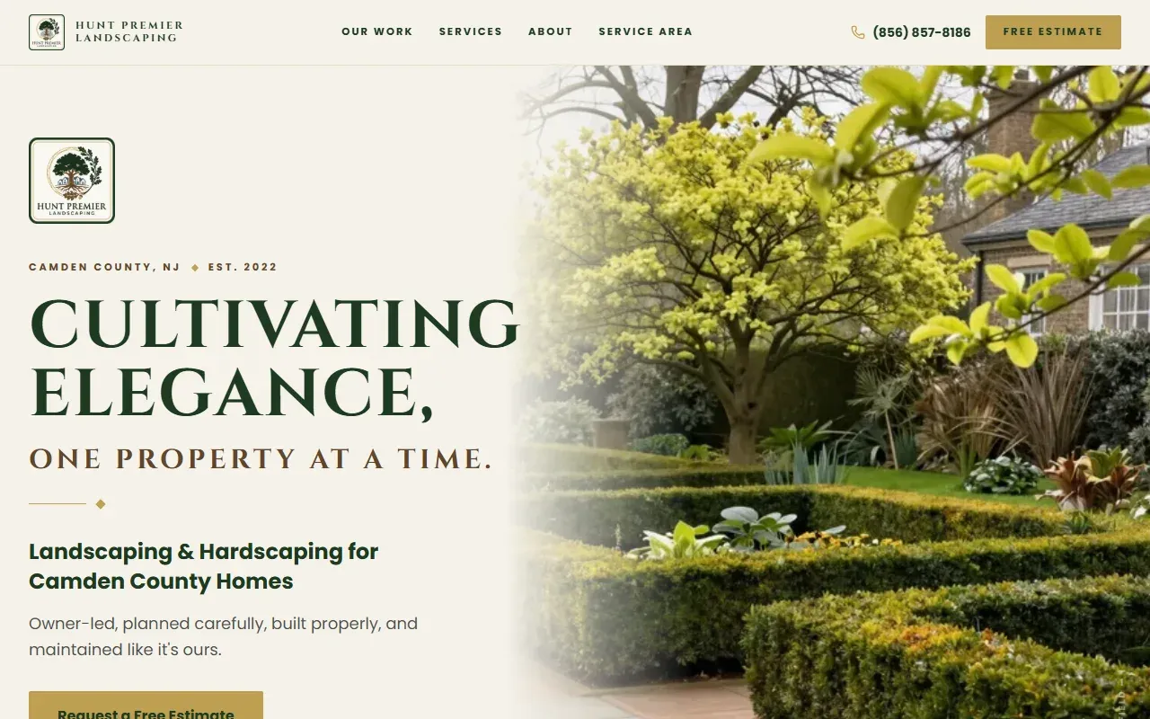 The huntpremierlandscaping.com home page: “Cultivating elegance, one property at a time.” beside a garden of clipped hedges under a yellow-green tree